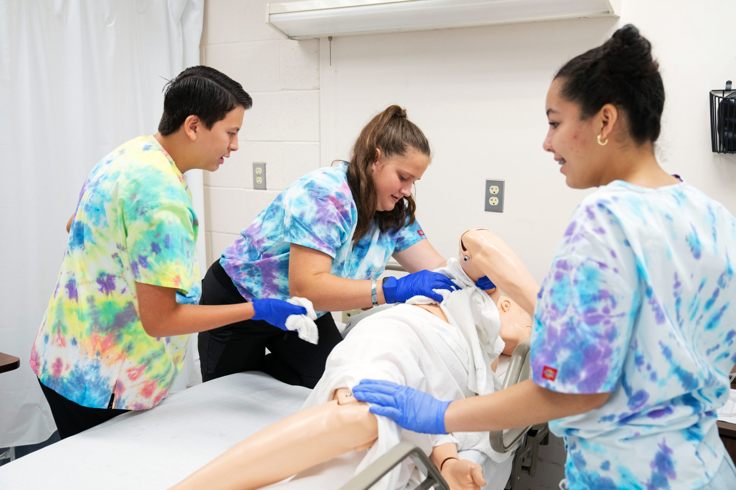 summer campers with nursing sim manikin